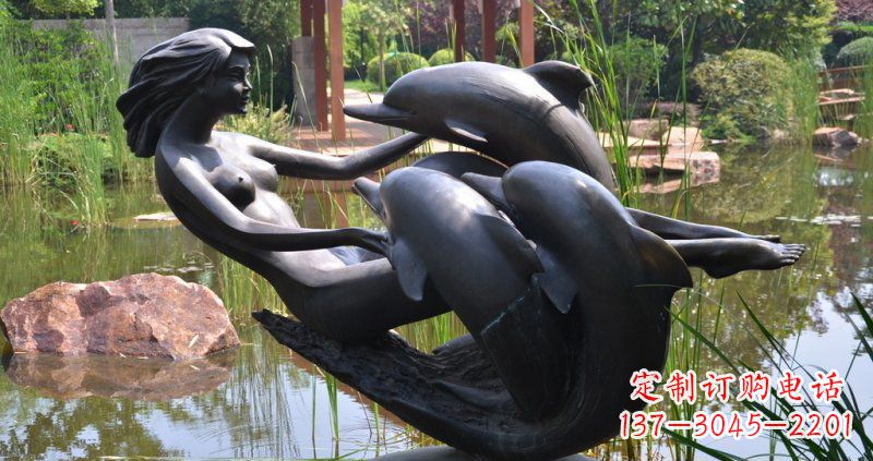 贵州公园海豚和女孩景观铜雕