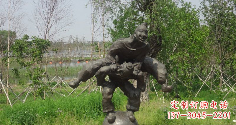 贵州园林站在球上面跳山羊的人物景观铜雕
